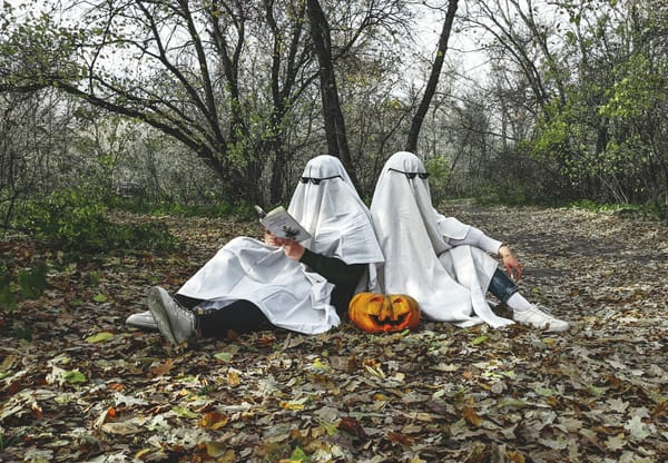 Family dressed in Halloween costumes